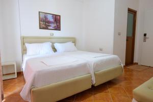 Postel nebo postele na pokoji v ubytování Hotel Piccolino