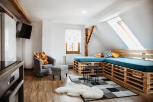 Televízia a/alebo spoločenská miestnosť v ubytovaní Joy Aparthotel Keilberg
