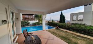 The swimming pool at or close to Athenian Luxury Villa in Glyfada