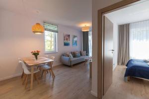 Łóżko lub łóżka w pokoju w obiekcie Mi Casa Holidays Apartamenty Olimpijska O2