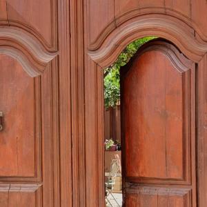 a wooden door with an arch in the middle at Casa Camboni-Dimora Storica Bed & Breakfast in San Vito