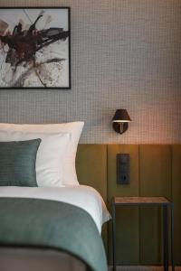 Postel nebo postele na pokoji v ubytování Q Hotel Plus Wrocław Bielany