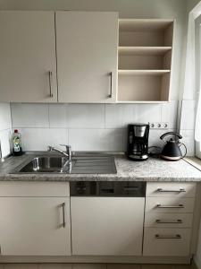 Kuchyň nebo kuchyňský kout v ubytování StayHome Apartment Bei Hamburg