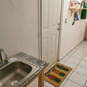 A kitchen or kitchenette at Lovely studio apartment with balcony AC & wi-fi, minutes from downtown!