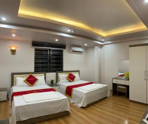 מיטה או מיטות בחדר ב-Quang Thang Cat Ba hotel