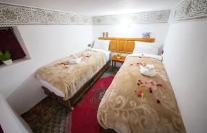 Postel nebo postele na pokoji v ubytování Riad Fes Basma