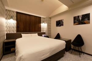 Postel nebo postele na pokoji v ubytování 555MOTEL SHONAN
