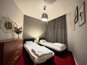 Posteľ alebo postele v izbe v ubytovaní Apartament Warszawa Centrum Helvetia Plus