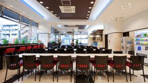 a conference room with a long table and chairs at Toyoko Inn Nishi-kawaguchi-eki in Warabi