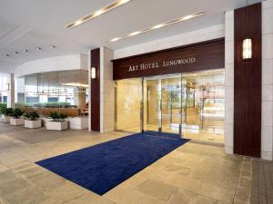 a large room with a blue rug and a blue floor at ART HOTEL Nippori Lungwood in Tokyo
