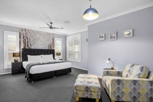 Ένα ή περισσότερα κρεβάτια σε δωμάτιο στο Luxury Coastal Escape