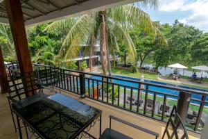 a balcony with a view of a pool at Samathi Lake Resort in Phnom Penh