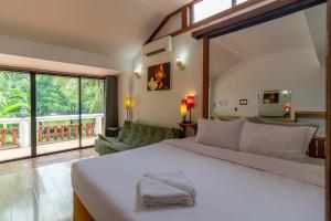 Ένα ή περισσότερα κρεβάτια σε δωμάτιο στο Samathi Lake Resort