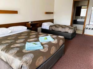 Postel nebo postele na pokoji v ubytování Dalvue Motel