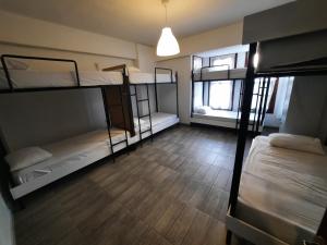 Postel nebo postele na pokoji v ubytování Kuyu Beergarden Hostel