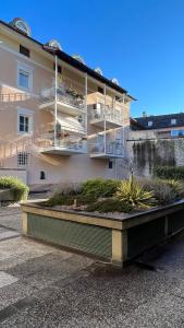 a building with balconies and plants in front of it at NEW Suite mar e monti in Appiano sulla Strada del Vino