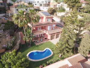 an aerial view of a house with a swimming pool at LU&CIA VILLA CANDADO in Málaga