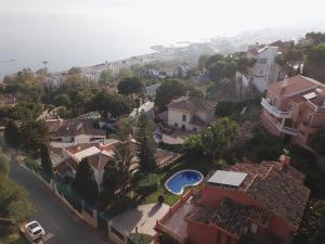 an aerial view of a residential neighborhood with houses at LU&CIA VILLA CANDADO in Málaga