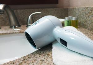 a hair dryer sitting on a counter next to a sink at Waterfront Hotel and Marina in Johnsburg