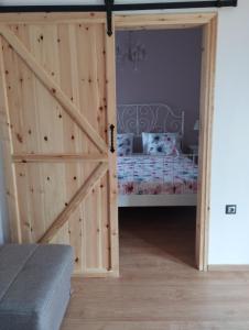 Postel nebo postele na pokoji v ubytování Olivelia