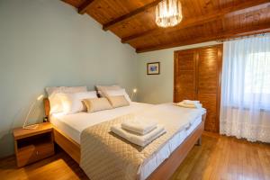Postel nebo postele na pokoji v ubytování Adriatic Bay Apartments + 37 fotografií