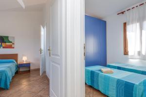Rúm í herbergi á Le Dimore di Nettuno