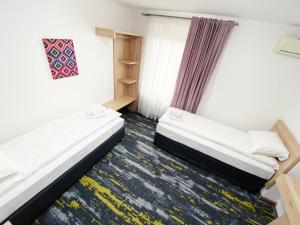 Letto o letti in una camera di Hotel Suljovic