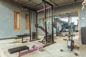 a gym with several exercise equipment in a room at Akusara Jungle Resort And Spa in Nusa Penida