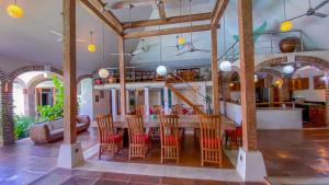 a dining room with a table and chairs at Bali Dyana Villas in Seminyak