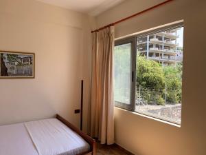Postel nebo postele na pokoji v ubytování The First Hotel Saranda