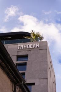 a building with a sign on the top of it at The Dean Galway in Galway