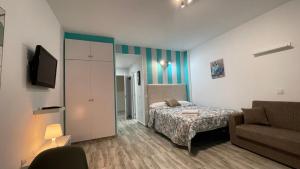 Łóżko lub łóżka w pokoju w obiekcie estudio con vista al mar 19