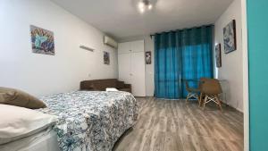 Łóżko lub łóżka w pokoju w obiekcie estudio con vista al mar 19