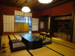 a room with a table and chairs in a room at Kizashi The Suite Kyoto Gion in Kyoto +28 photos