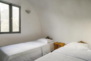 Postel nebo postele na pokoji v ubytování Exi Sea Side Suites