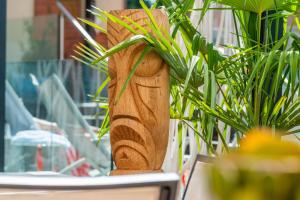 a wooden planter sitting on a table with plants at Mercure Toulouse Centre Saint-Georges in Toulouse