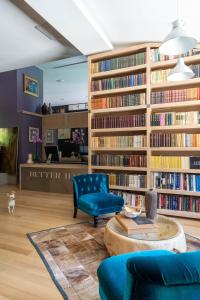 a living room with a library with bookshelves at VILLA YANA Hotel Winery&Spa in Stara Zagora
