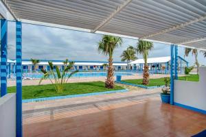 a view of the pool from the lobby of a resort at مراسي الأحلام لبيوت العطلات in Al Lith