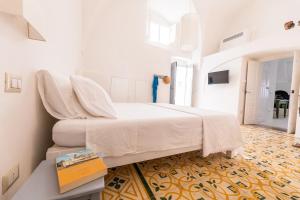Un pat sau paturi într-o cameră la Casa Marta holiday home