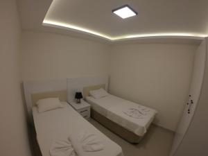 Postel nebo postele na pokoji v ubytování Dalyan Elit Apart Otel