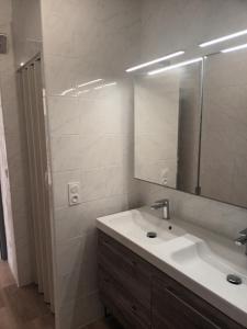 a bathroom with a sink and a mirror at AZUREO - Terrasse du golfe in Morsiglia +22 photos
