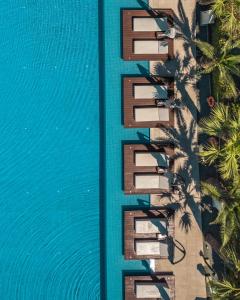 an overhead view of a building next to a pool at Nestor Hotel in Ayia Napa