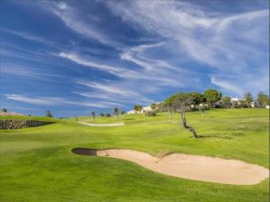 a view of a golf course with a green field at WOW Flat, Birdie, Golf, Spa & Swimming Pool (WIFI) in Lagos