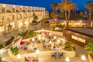 an aerial view of a hotel patio at night at Hotel Cabogata Jardín in Retamar