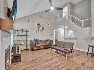 a living room with a couch and a fireplace at A Taste of Austin in Austin