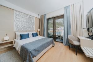 Postel nebo postele na pokoji v ubytování Katamare Hotel + 32 fotografií