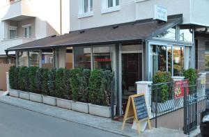 a store front with a sign in front of it at Voždovac Vitanovacka in Belgrade