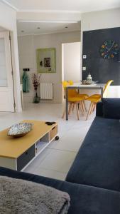 a living room with a couch and a table at Oriñon Beach Apartment in Oriñón