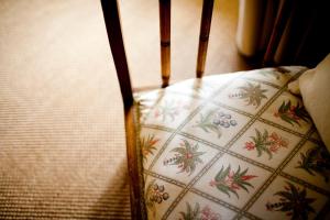 a seat of a chair with a floral pattern at Arkaba Homestead in Hawker