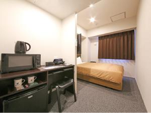 Letto o letti in una camera di HOTEL LiVEMAX Chiba Chuo-Ekimae